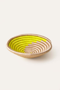 Woven african basket with neon green yellow spiral swirl pattern 
