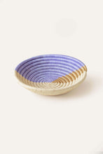 Woven african basket light purple and beige abstract pattern.