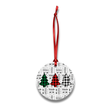 Round Christmas ornament with tree designs on a white background