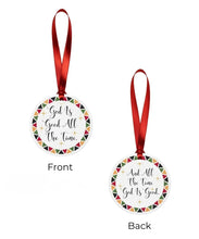 Round Christmas ornament with 'God is Good All the Time' text on a red ribbon, shown from front and back views.