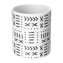 center view of a white ceramic coffee mug with a black abstract tribal pattern