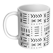 white and black 11 ounce coffee mug with a black african pattern