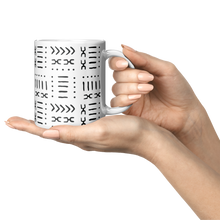 11 oz white ceramic coffee mug held in hand