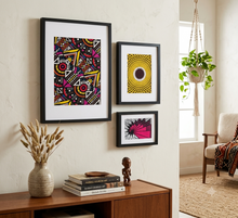 set of 3 african fabric art hung on the wall