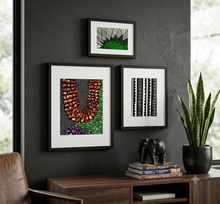 african fabric wall art hung in a home office
