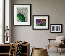 african fabric art hung on the wall in a modern home