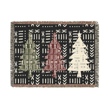 Woven blanket with geometric pattern on a black background