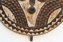 Decorative wood wall mask with geometric patterns on a white background