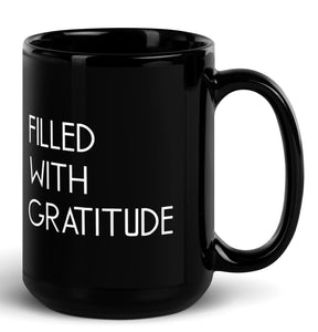 large black coffee mug positive saying on it