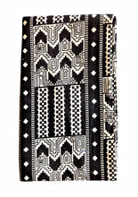 Black and white patterned fabric head wrap on a white background