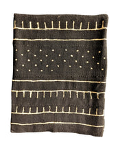 Black white mud cloth fabric with white patterns on a white background