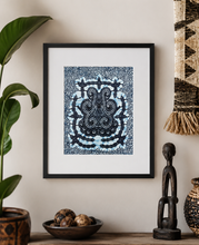 blue african fabric wall art hung in a modern home with african accents