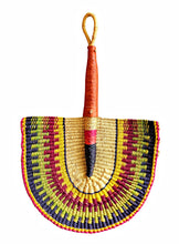 Colorful woven fan with a wooden handle on a white background