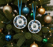 Decorative blue ornament with a blue ribbon on a white background