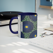 blue yellow coffee mug on desk