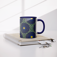 blue yellow african pattern coffee mug on book