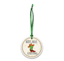 Decorative ornament with 'Boots, Bells & Blessings' text and cactus illustration on a white background.