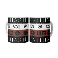two ceramic coffee mugs with a brown, black and white African pattern design.