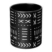 center view of a black coffee mug with white african pattern 