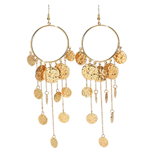 Gold hoop earrings with dangling gold coins and chains on a white background