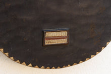 Close-up of a dark brown wood mask 