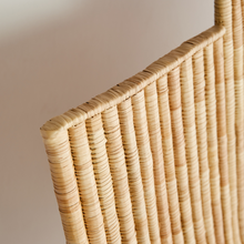 Close-up of a woven basket with a neutral background