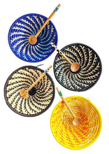 Small woven baskets with wooden spoons in various colors on a white background