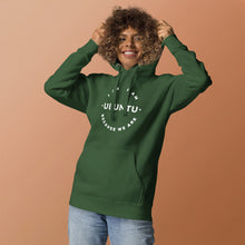 Person wearing a green hoodie with african proverb on a brown background