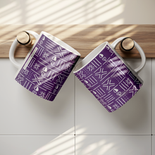 two ceramic coffee mugs with purple and white african pattern