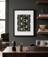 cowrie shell pattern african fabric art hung on the wall in an office