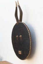 Decorative wall wood wall art with a round face and antelope antlers 