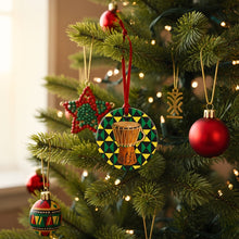 Decorative Christmas ornaments on a tree with a focus on a drum-themed ornament.