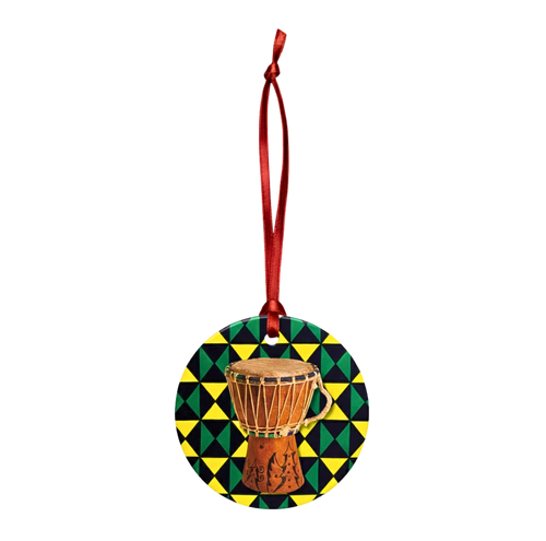 Decorative ornament with a drum design on a geometric patterned background, hanging from a red ribbon.