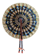 Decorative fan with intricate patterns on a white background