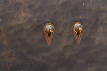 eye features on a wood wall mask 