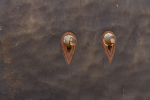 eye features on a wood wall mask 