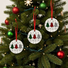 Decorative Christmas ornaments with tree and checkered patterns on a Christmas tree.