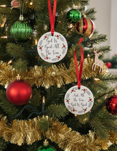 Decorative Christmas ornaments with 'God is Good All the Time' text on a Christmas tree.