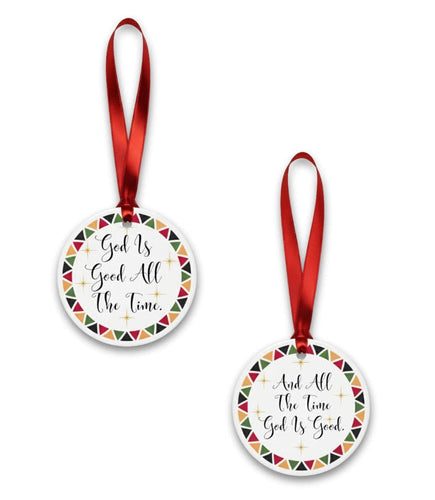 Two circular ornaments with red ribbons on a white background