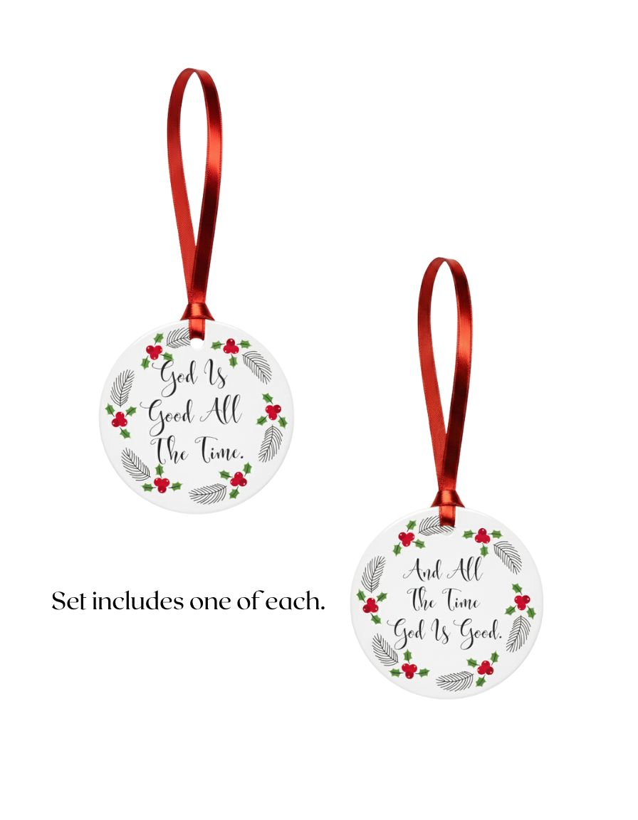 Two circular religious Christmas ornaments with red ribbons on a white background.