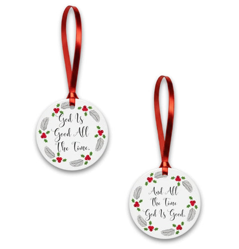 Two round Christmas ornaments with red ribbons on a white background