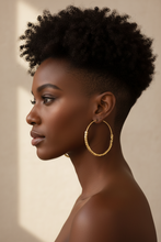 Gold hoop earrings with bead detailing on a beige surface, shown with measurements.