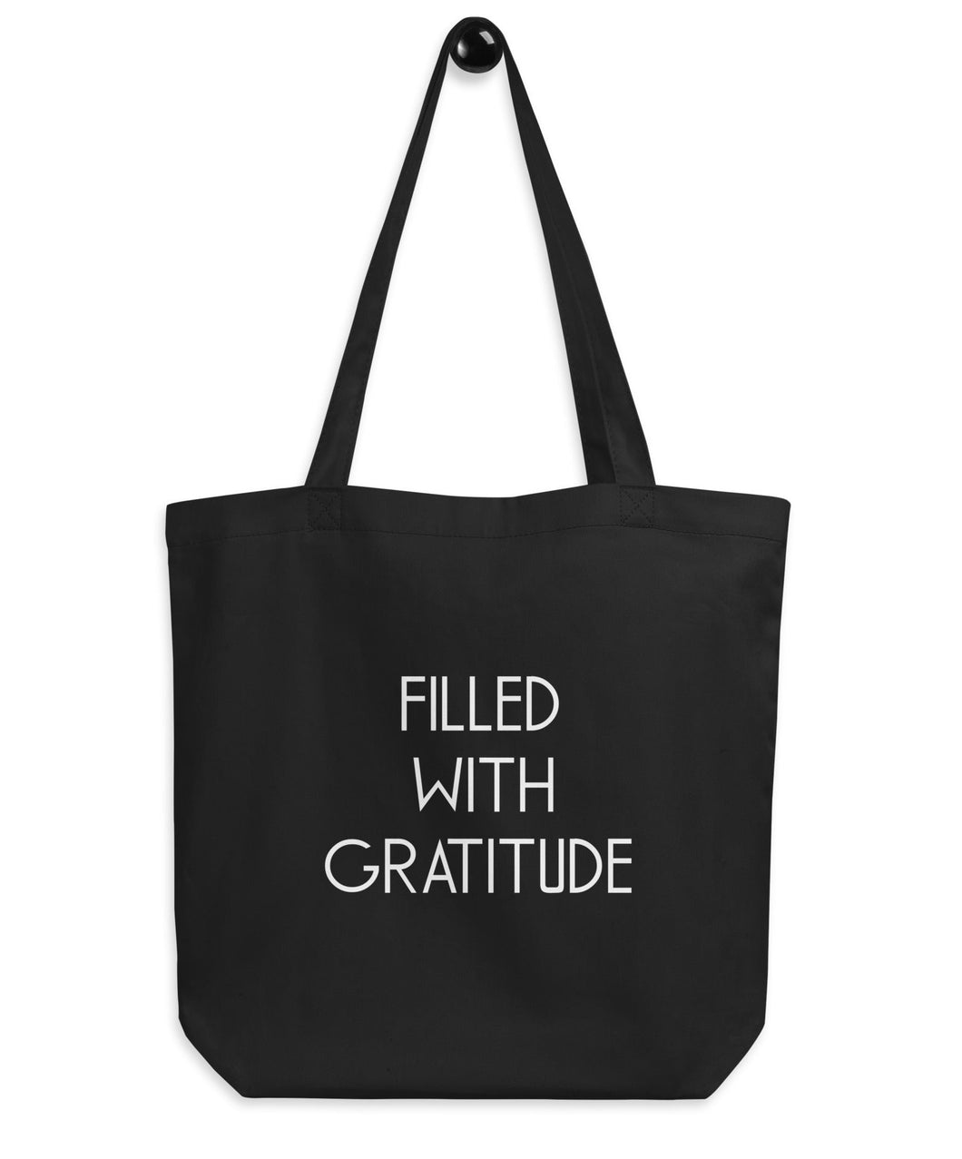 black totebag with a gratitude phrase on it