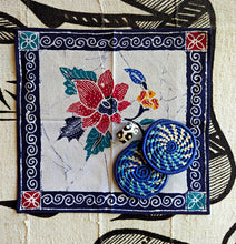 Decorative cotton napkin with floral, drink coasters and napkin ring.
