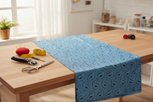 Blue fabric with a pattern on a white background