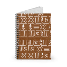 A spiral-bound notebook with a brown cover featuring a white geometric tribal pattern, shown on a clean white background.