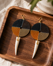long-african-bead-earrings-on-a-wood-jewelry-tray