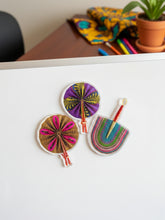 Colorful acrylic magnets on a whiteboard 