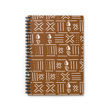 A spiral-bound notebook with a brown cover decorated in a white hand-drawn tribal pattern, shown on a clean white background.