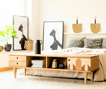 woven african hand fan on wall